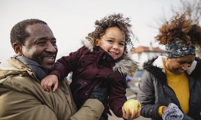a family of three people going out
