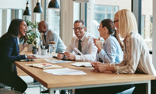 a group of people at meeting desk
