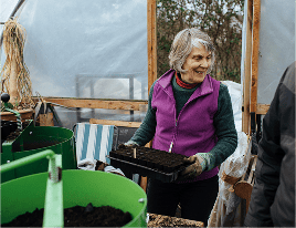 A woman planting seeds