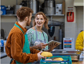 Two people baking bread